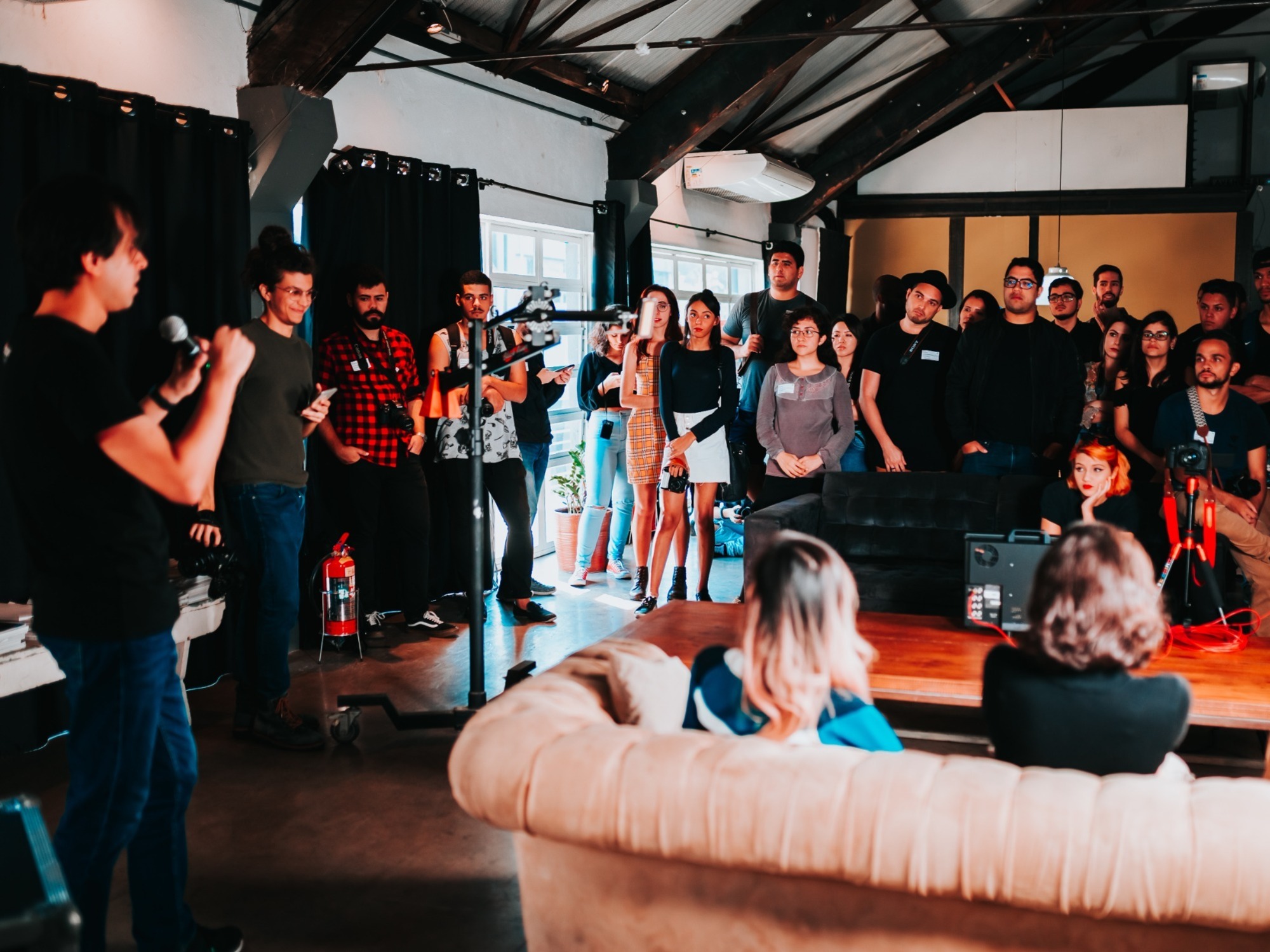 people gathered near an event speaker