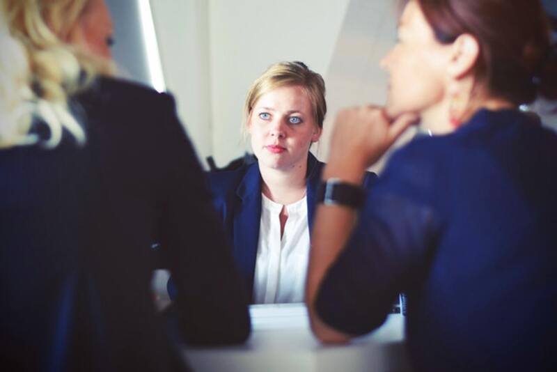 a woman being interviewed for a job